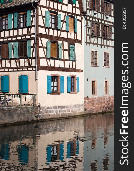 Half Timbered House in Strasbourg, with reflection in canal. Half Timbered House in Strasbourg, with reflection in canal