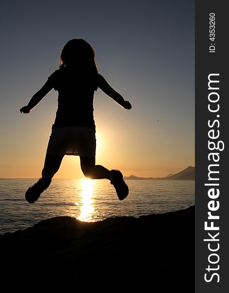 Silhouette Of Jumping Girl
