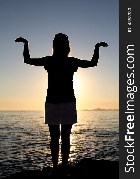 Silhouette of standing girl. High quality image