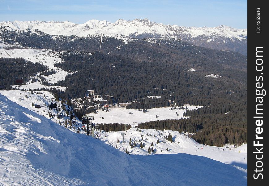 Beautiful snowscape with slope and trees