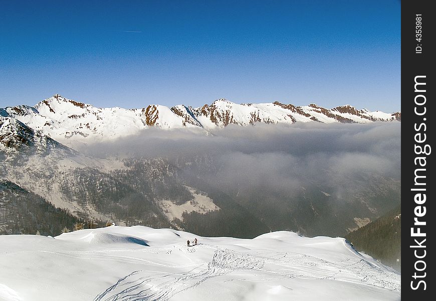 On the top of a mountain above the clouds