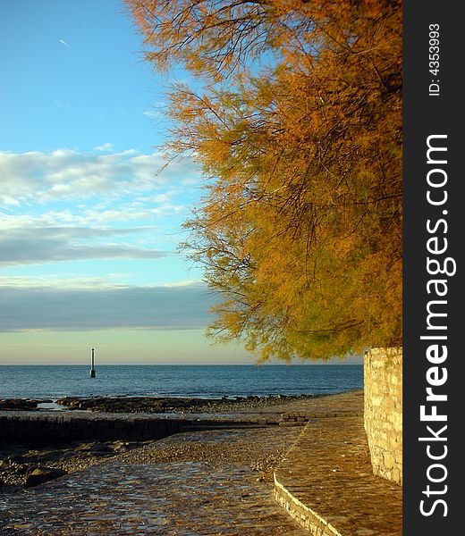 Sunset light walking on the seacoast in late autumn. Sunset light walking on the seacoast in late autumn