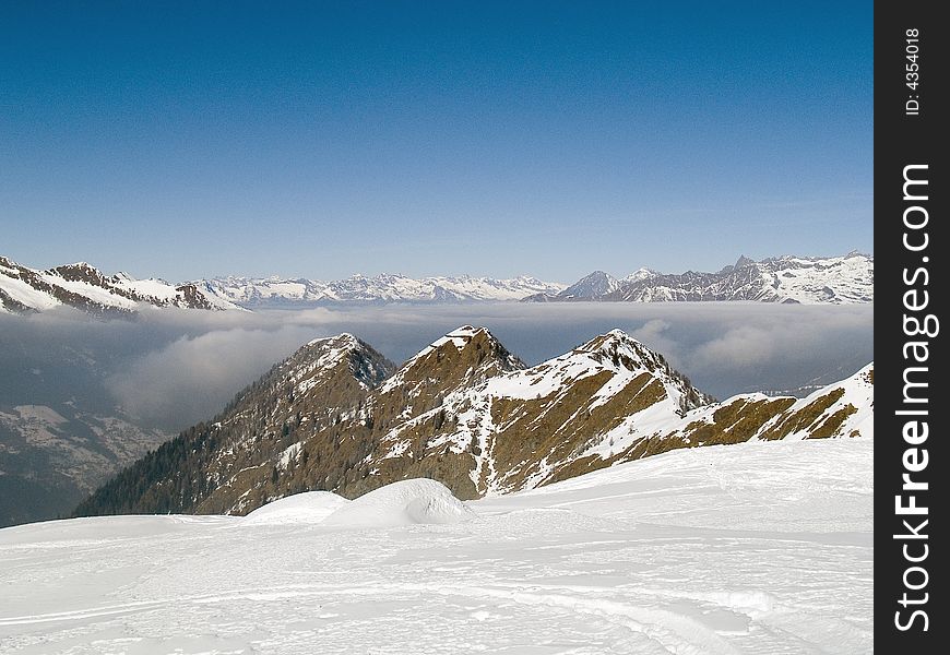 On the top of a mountain above the clouds