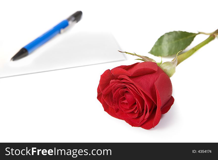 Red rose with envelope and pen in background. Red rose with envelope and pen in background