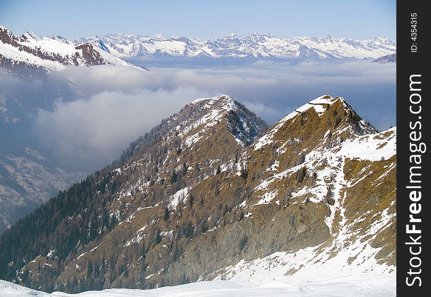 On the top of a mountain above the clouds