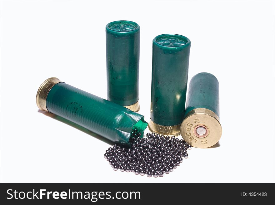 Shotgun cartridges 2 standing up one open with lead shot coming out