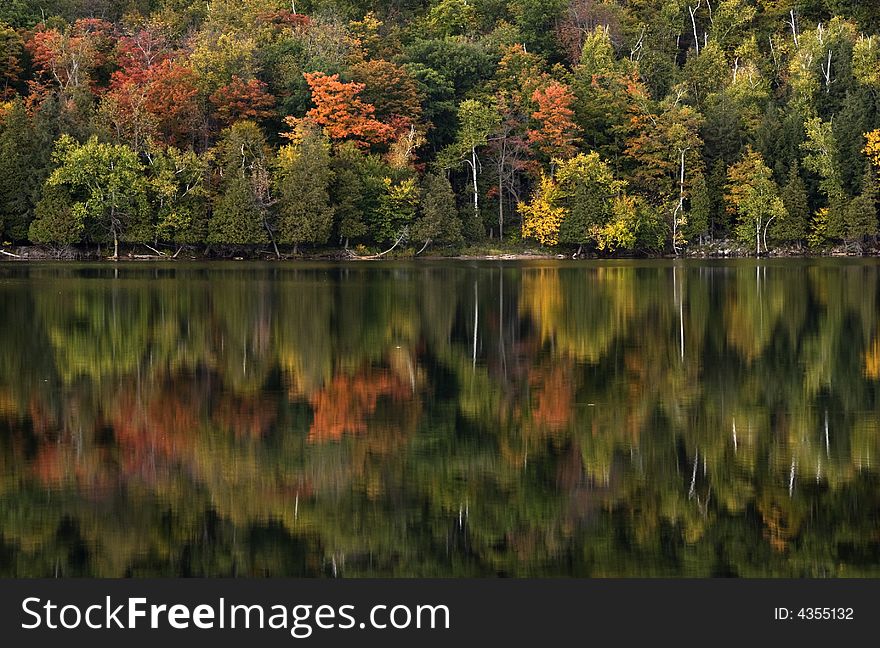 Reflection of autumn leaves on Meech Lake in Gatineau, Quebec. Reflection of autumn leaves on Meech Lake in Gatineau, Quebec