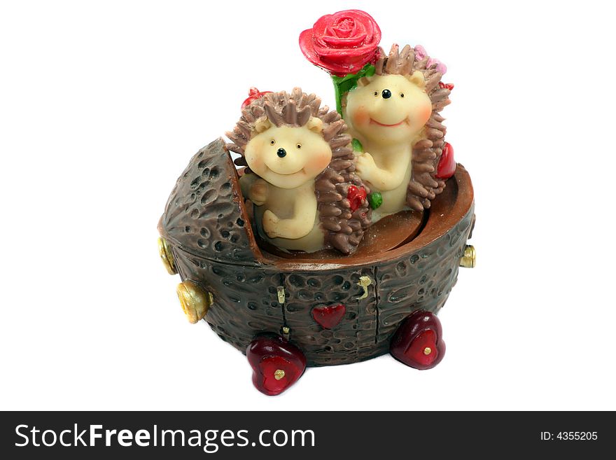 Statuette: Hedgehogs on car (isolated)