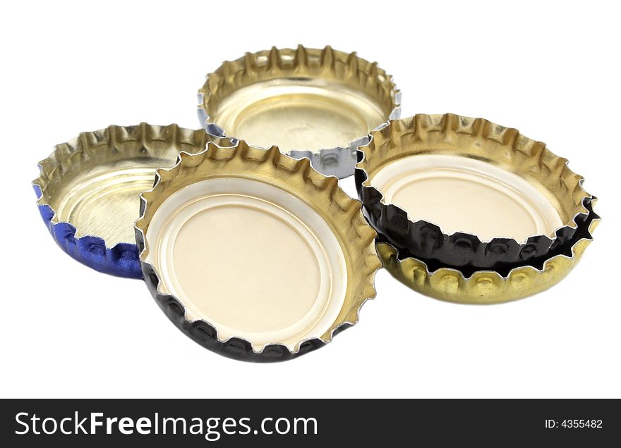 Different lids from beer on white background