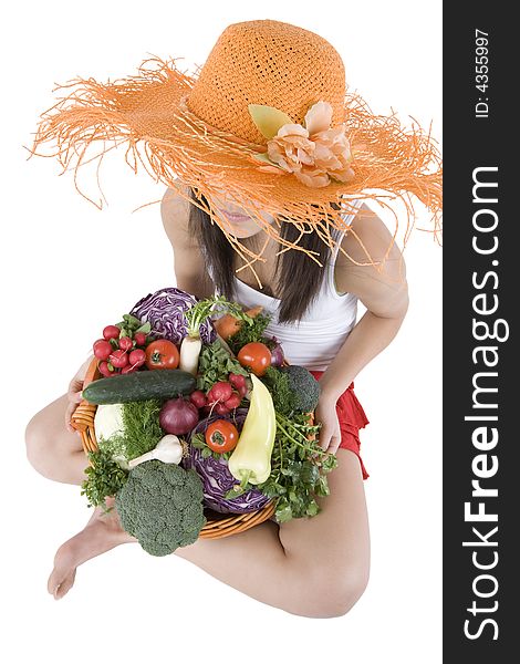 Teenager hold a basket of full vegetables before a white background. Teenager hold a basket of full vegetables before a white background
