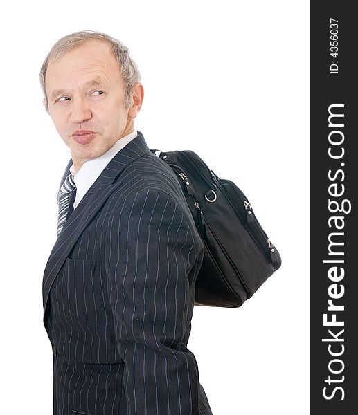 The adult businessman with a bag isolated on a white background. The adult businessman with a bag isolated on a white background