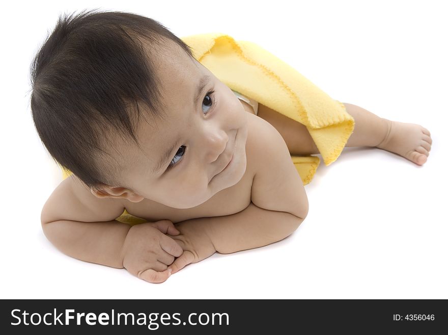 Charming baby with yellow soft cover before white background