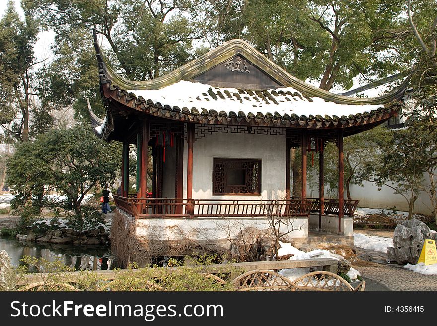 The  roof of an ancient pavilion decoated with snow.This picture is taken in Zhuozheng park in Suzhou ,China. The  roof of an ancient pavilion decoated with snow.This picture is taken in Zhuozheng park in Suzhou ,China