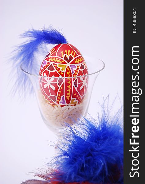 Easter egg with plumage and glass