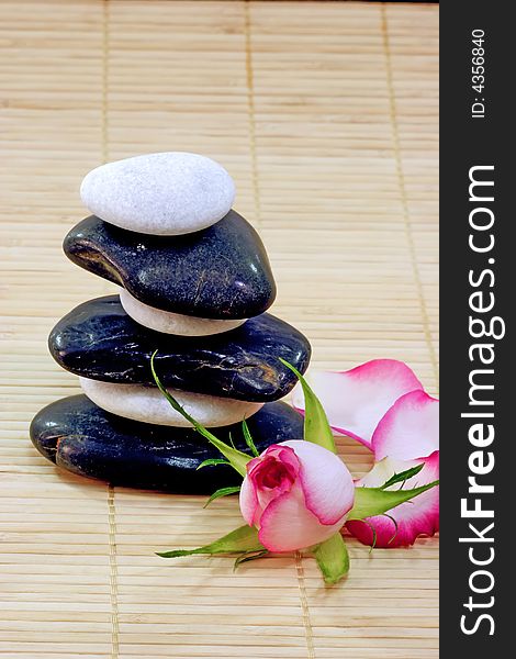 Some stones arranged on a wooden mat. Some stones arranged on a wooden mat.