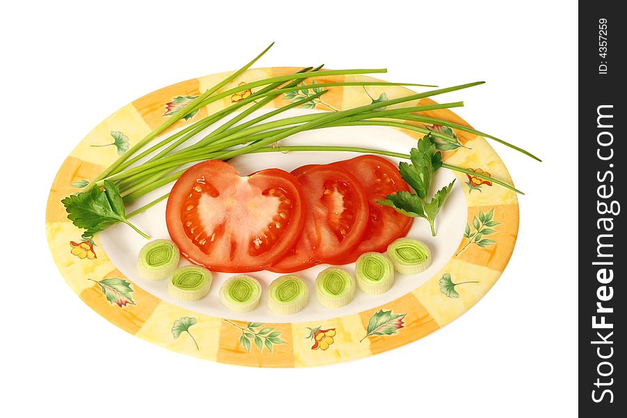 Fresh, early vegetables on oval plate