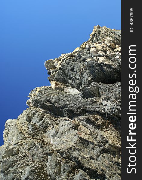 Argentiera Rocks formation against Blue Sky