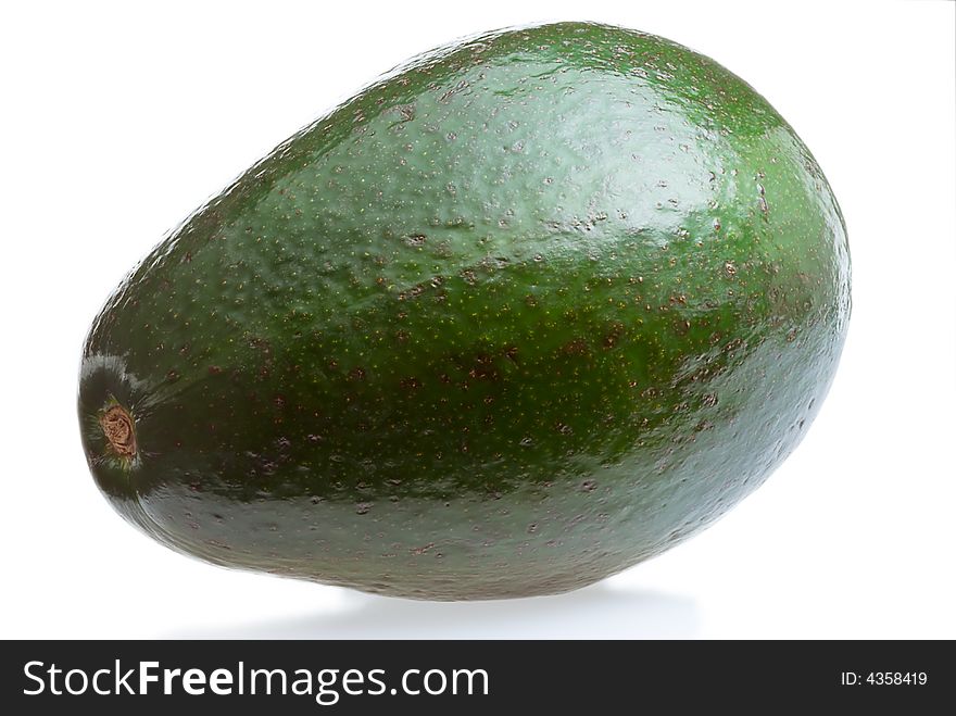 A closed up shot of an avocado isolated on white background with a faint shadow