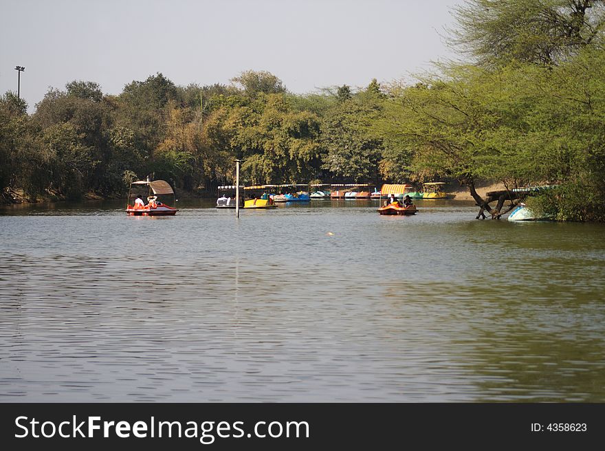 The lake at Old Fort is is a popular picnic spot at New Delhi. The Old Fort, also known as Purana Qila, is just behind the lake. The lake at Old Fort is is a popular picnic spot at New Delhi. The Old Fort, also known as Purana Qila, is just behind the lake.