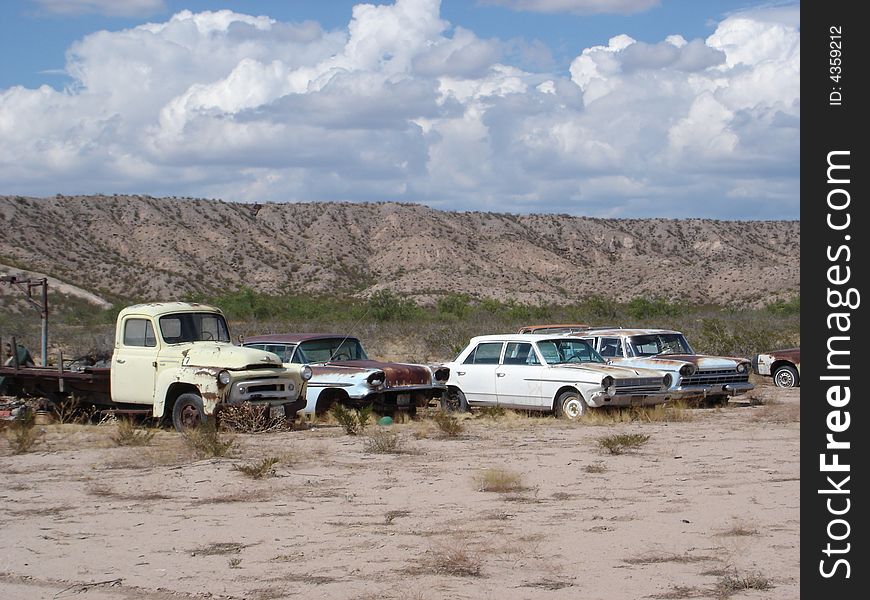 Cars lined up in the desert. Cars lined up in the desert