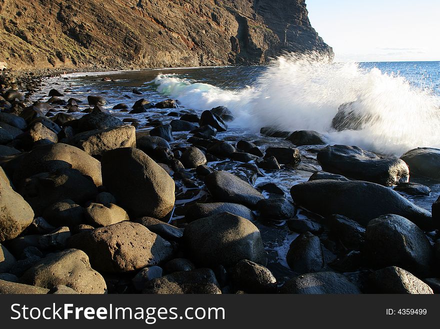 Sea waves on stony coast