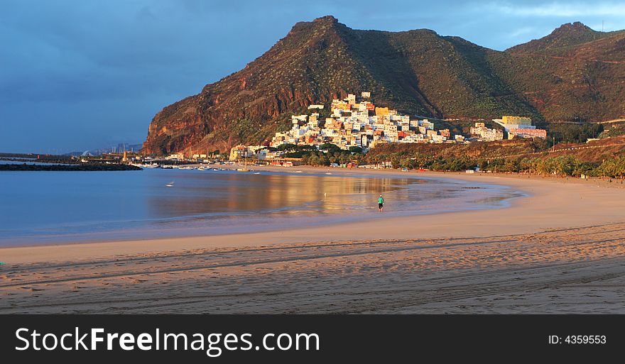 Sand beach with summer resort in the background. Sand beach with summer resort in the background