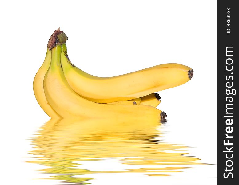Bunch of bananas reflected on water