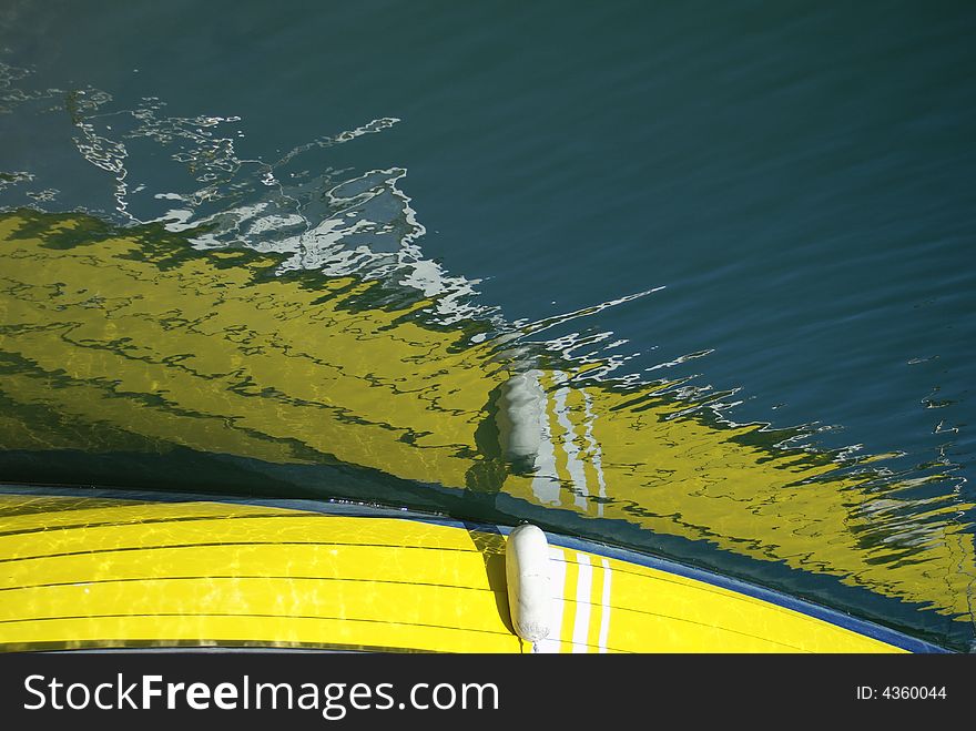 Yellow boat reflections in a port. Yellow boat reflections in a port