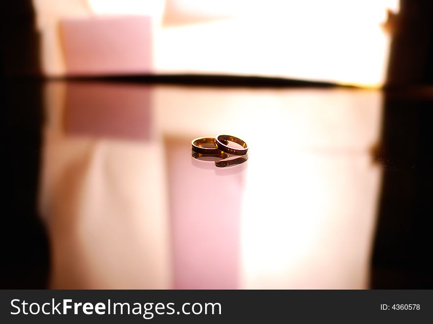 Rings on glass with lightbox behind