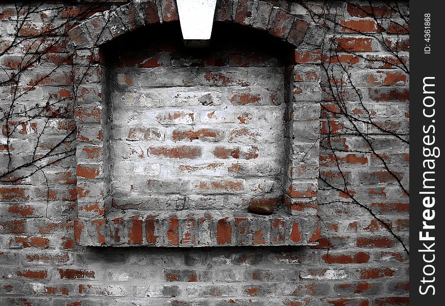 Old wall with a blind window.