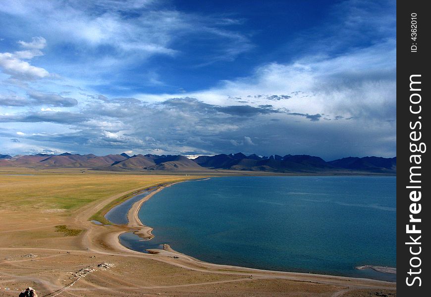 This photo is the scene of Namsto lake, Tibet, China. This lake is a holy site in Tibet buddhism tales. It's the highest lake in the world at an Altitude of about 4,700 metres (15,420 feet).