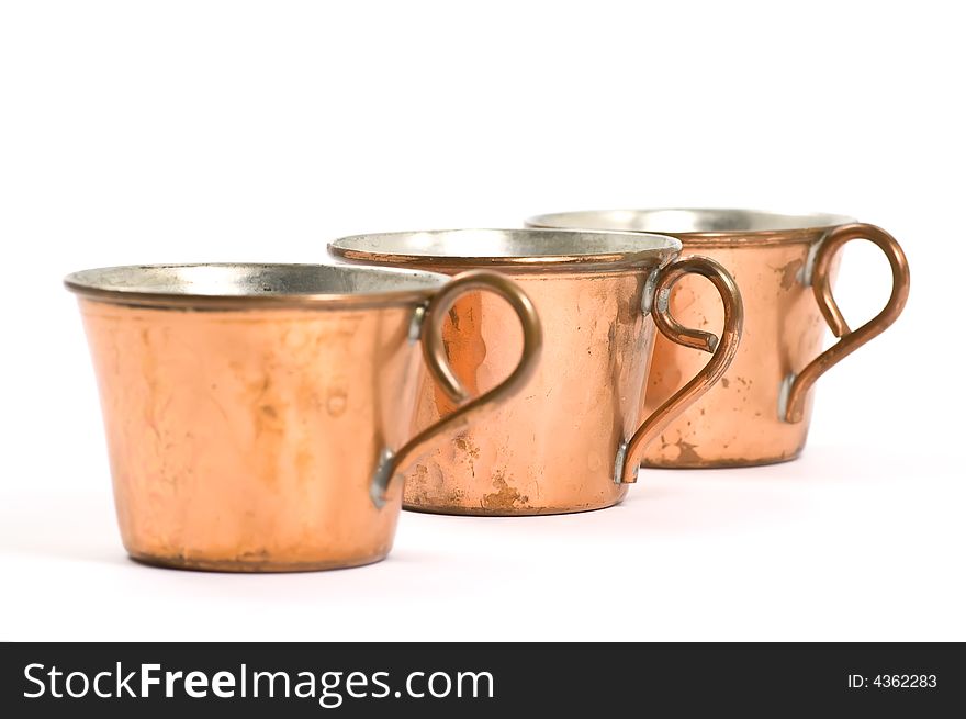 Old and scuffed copper cups