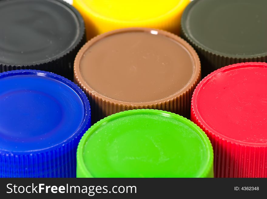 Close up on colorful paint bottles