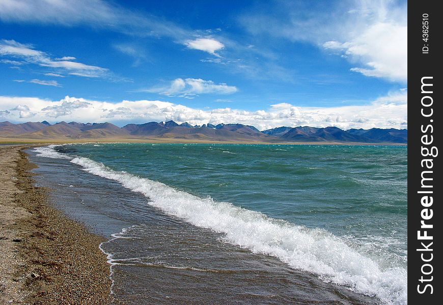 This photo is the scene of Namsto lake, Tibet, China. This lake is a holy site in Tibet buddhism tales. It's the the world's highest lake at an Altitude of about 4,700 metres (15,420 feet).