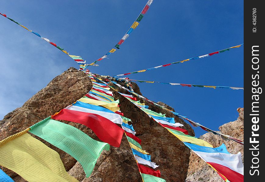 This photo was taken at the side of Namsto lake, Tibet, China. This lake is a holy site in Tibet Buddhism tales. Which is the world's highest lake at an altitude of about 4,700 metres (15,420 feet). The letions were written on the Tibet flag by Titetan for praying and blessing. This photo was taken at the side of Namsto lake, Tibet, China. This lake is a holy site in Tibet Buddhism tales. Which is the world's highest lake at an altitude of about 4,700 metres (15,420 feet). The letions were written on the Tibet flag by Titetan for praying and blessing.