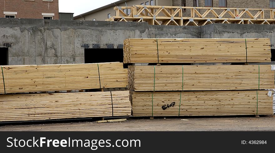 Stacks of lumber at a commercial construction site. Stacks of lumber at a commercial construction site