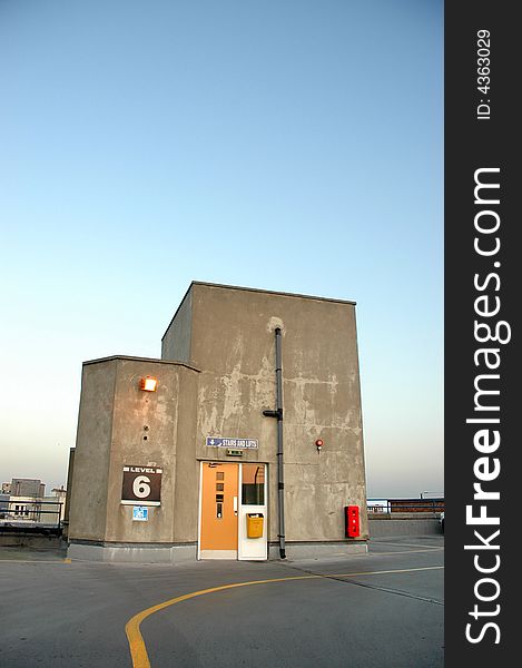 Car Park Stair well and lifts in gentle evening light with big sky. Car Park Stair well and lifts in gentle evening light with big sky