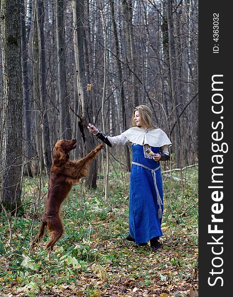 Portrait of the girl and irish setter in autumn forest. Portrait of the girl and irish setter in autumn forest.