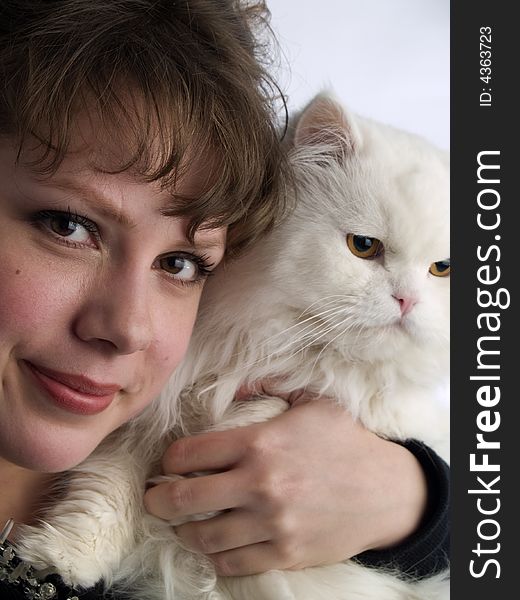 Beautiful young lady white background in glasses holding white cat. Beautiful young lady white background in glasses holding white cat