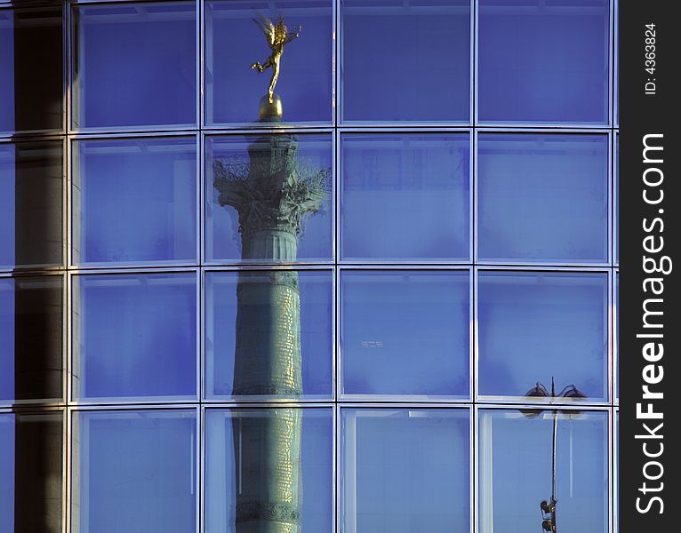 France, Paris: nice view of the bastille column reflected on the opera windows.