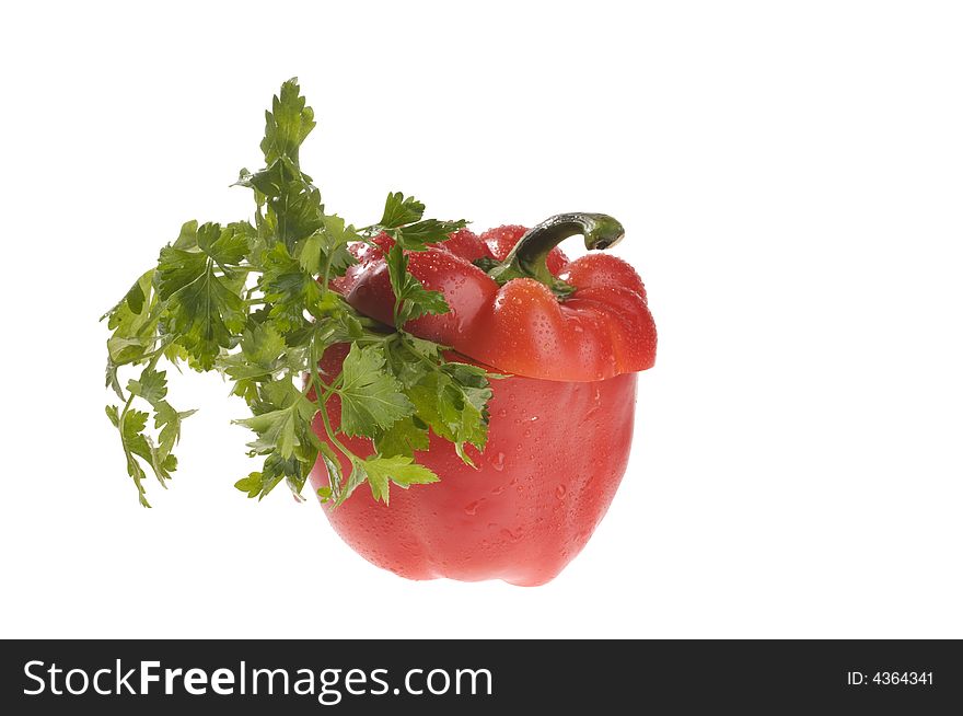 Green parsley and red pepper isolated over white. Green parsley and red pepper isolated over white.