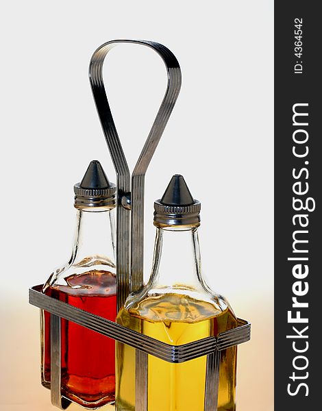 Oil and Vinegar Bottles in Metal Rack