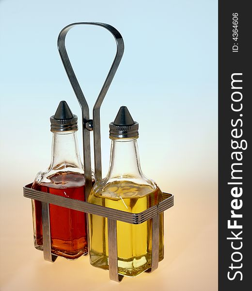 Oil and Vinegar Bottles in Metal Rack