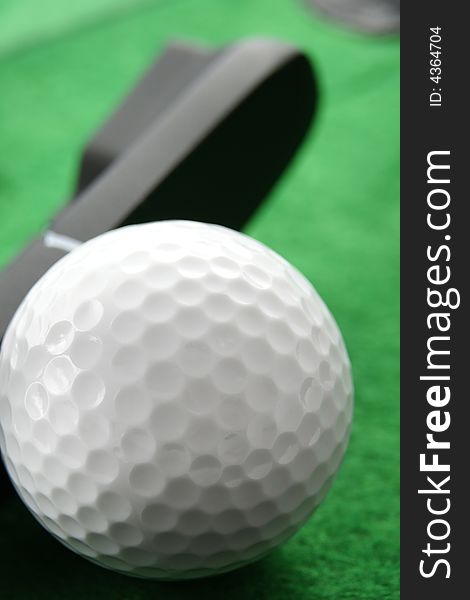 Golf ball. Iron hitting golf ball in motion