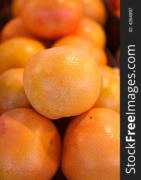 Oranges for sale in a basket on a open air market stall