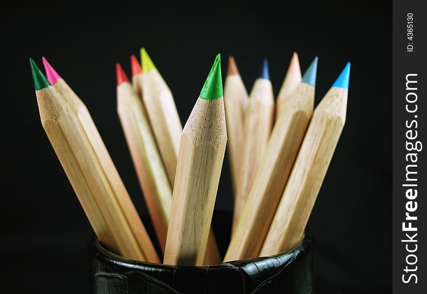 Macro shot of sharpened, natural wood colored pencils with shavings. Macro shot of sharpened, natural wood colored pencils with shavings