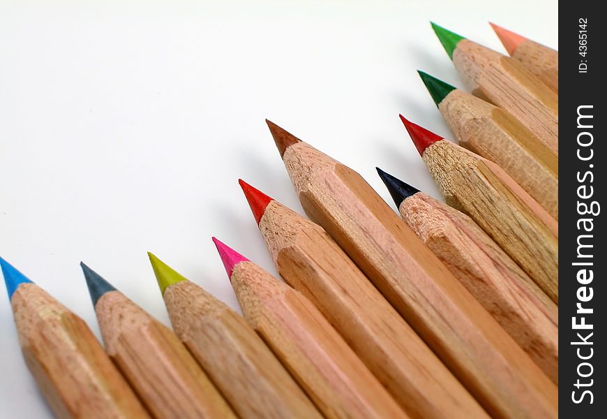 Macro shot of sharpened, natural wood colored pencils with shavings. Macro shot of sharpened, natural wood colored pencils with shavings