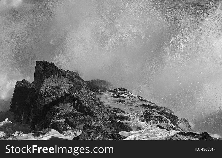 Crashing waves on rocks on the maine coast in January
