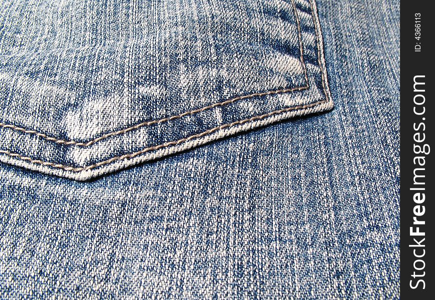 Detail of a pocket in a blue jeans