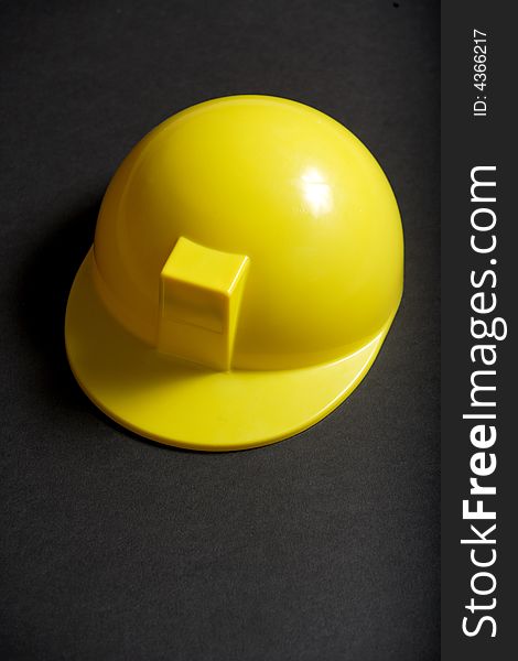 A yellow Hard Hat in the studio